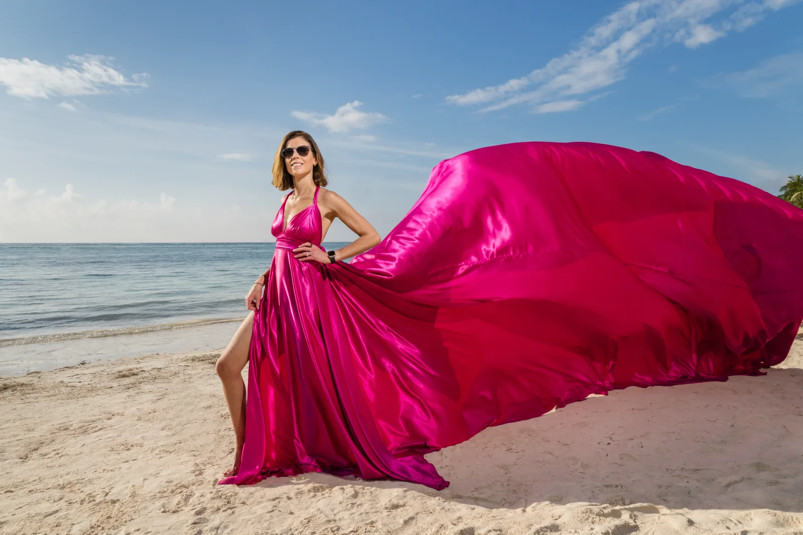 Woman on the beach in Riviera Maya in a flying dress